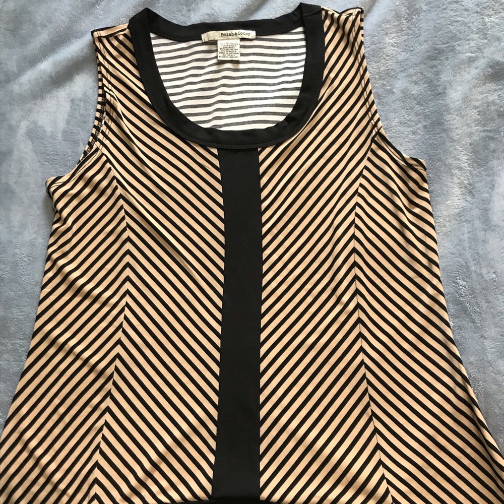 Woman’s light brown and black shirt